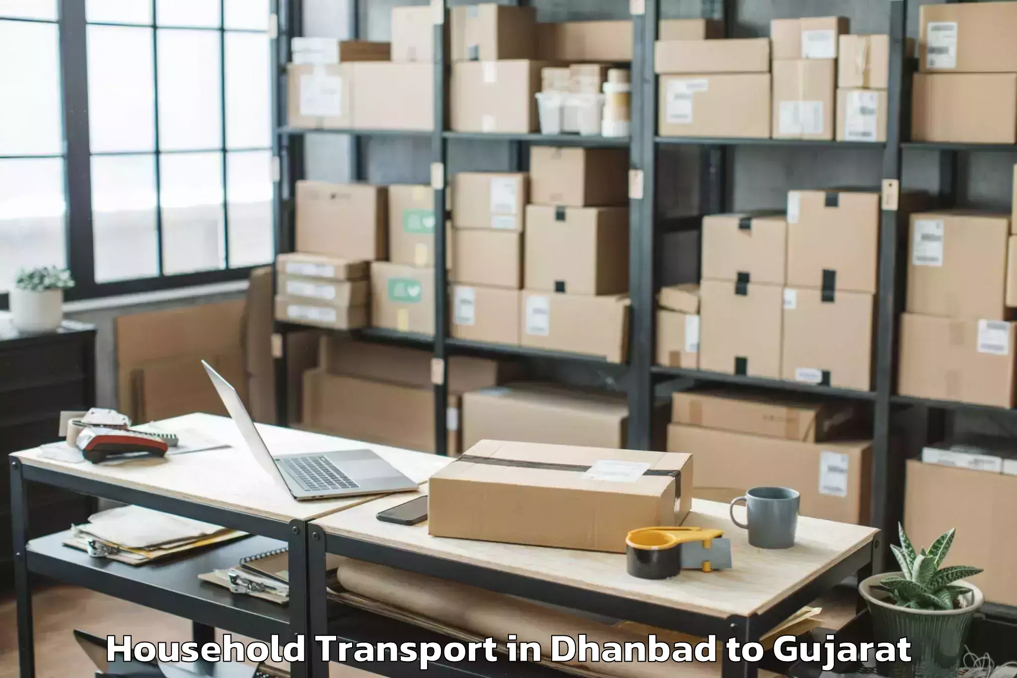 Affordable Dhanbad to Jhalod Household Transport